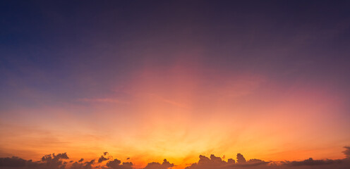 Wall Mural - morning sunrise sky with sunset colorful orange sun rays and dark clouds