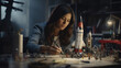 A girl building a model rocket inspired by female astronauts.