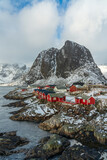 Fototapeta  - View of fishermen village with typical red houses in Lofoten