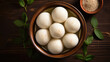 Top view of a plate of Indian traditional sweet dessert rasgulla, bengali sweets. White Ball dumplings made of chhena dough cooked in a light sugar syrup.