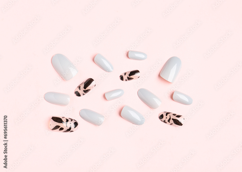 Press-on nails on pink background