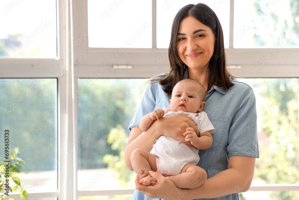 Young woman with her baby at home