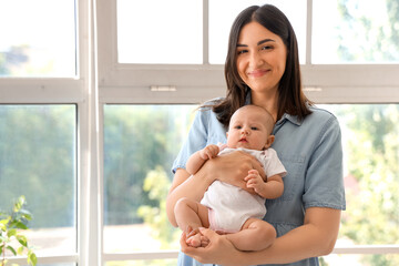 Sticker - Young woman with her baby at home