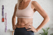 © Pixel-Shot - Body positive mature woman training in gym, closeup