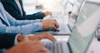 © Wesley JvR/peopleimages.com - Hands, laptop and business people in office consulting for contact us, crm or faq communication closeup. Keyboard, typing and consultant team online for email market, research or planning or service
