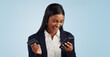 © Wesley JvR/peopleimages.com - Excited business woman, phone and credit card for payment or online shopping against a blue studio background. Happy female person smile with mobile smartphone for banking or transaction on mockup