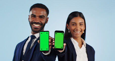 Sticker - Business people, portrait and phone with green screen for advertising against a blue studio background. Businessman and woman employee showing mobile smartphone display, chromakey or mockup space