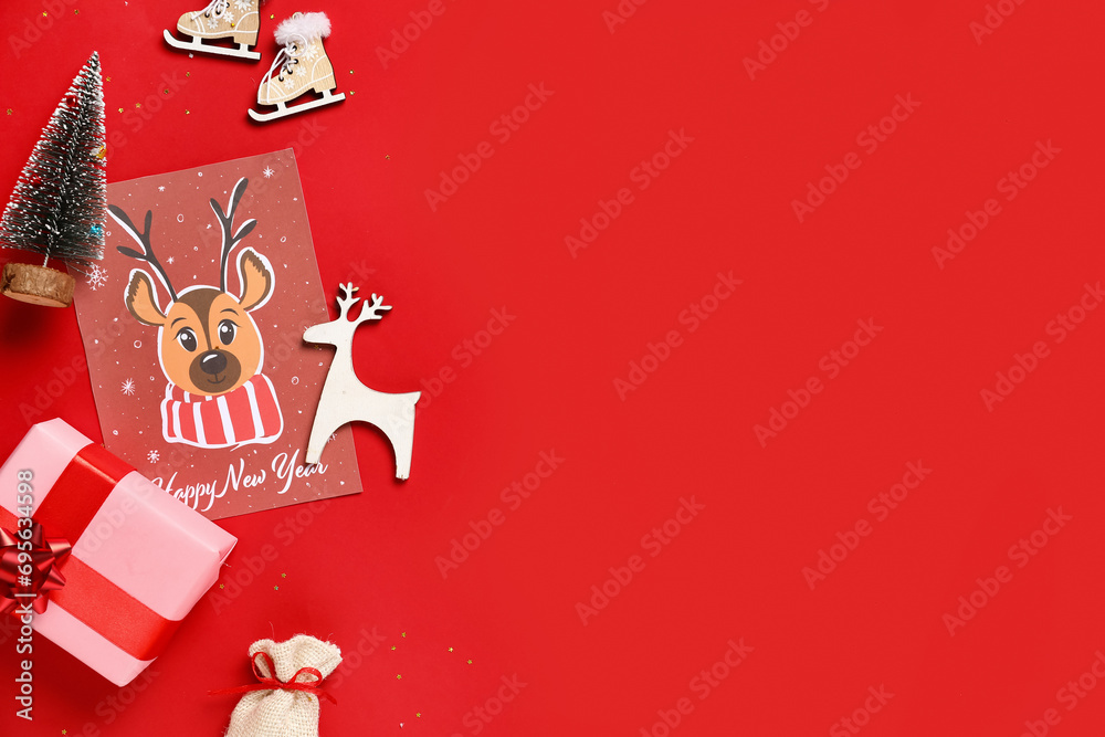 Beautiful composition with gift box, greeting card and different Christmas decorations on red background