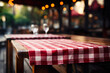 Outdoor restaurant table with checkered tablecloth