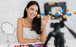 © Art_Photo - Smiling pretty woman beauty clean fresh healthy white skin blogger in front of camera recording video content for live stream chat talking with makeup cosmetic for internet social network at home