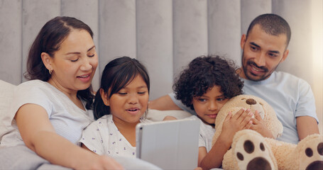 Sticker - Tablet, smile and children with parents in bed watching a video on social media together at home. Happy, bonding and young mother and father relaxing with kids in bedroom with digital technology.