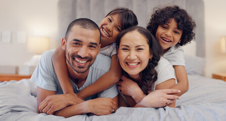 Poster - Portrait, happy and kids with parents in bed relaxing and bonding together at family home. Smile, fun and young mother and father laying and resting with children in bedroom of modern house.