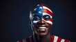 Smiling Afro black man with face paint painted in the color of the flag of the United States of America.