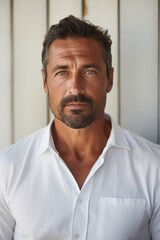 Aufkleber - A picture of a man with a beard wearing a white shirt. This versatile image can be used for various purposes
