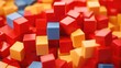 A vibrant pile of red, yellow, and blue blocks. Can be used for educational purposes or as a visual representation of creativity and imagination