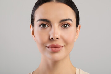 Sticker - Portrait of beautiful young woman on grey background