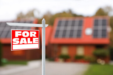 Sticker - Sale sign near beautiful house outdoors. Red signboard with words