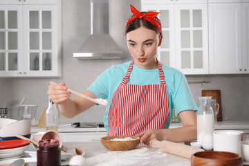 Canvas Print - Beautiful woman cooking in kitchen. Dirty dishware, food leftovers and utensils on messy countertop