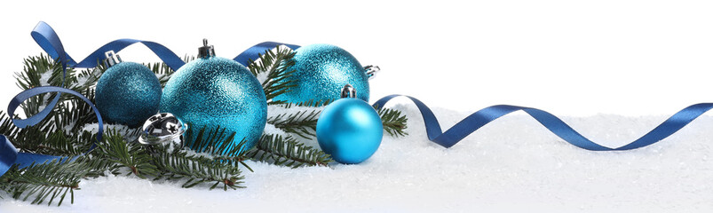 Wall Mural - Beautiful light blue Christmas balls, fir tree branch and ribbon on snow against white background