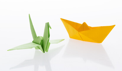 Wall Mural - Origami boat and crane on white background