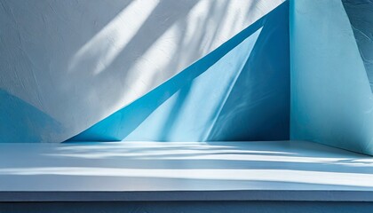 Wall Mural - an original background image for design or product presentation with a play of light and shadow in light blue tones