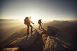 Couple of hikers on top of high mountains at sunset or sunrise, walking and enjoying their team achievement, climbing success, adventure  and freedom, looking towards the horizon