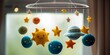 Baby mobile with plush stars and planets