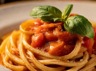 Italian traditional homemade recipe of spaghetti pasta. Closeup photography.