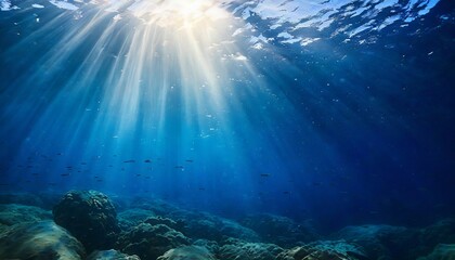 abstract image of tropical underwater dark blue deep ocean wide nature background with rays of sunlight