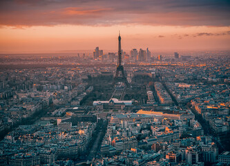 Wall Mural - Paris, France: Aerial view over the city with Eiffel tower and La Defense modern architecture behind it