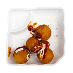 Wall Mural - Traditional Takoyaki made of octopus dished up in service plate with soya-bean sauce. Isolated over white background