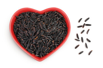 Poster - Black rice in a red ceramic bowl isolated on white background. Top view. Flat lay