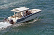sport fishing boat powered by two outboard engines