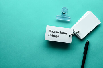 Poster - There is word card with the word Blockchain Bridge. It is as an eye-catching image.