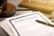 © New Africa - Last Will and Testament, pen and gavel on wooden table, closeup