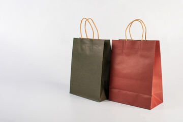  Red and green paper shopping bag on white background.