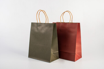  Red and green paper shopping bag on white background.