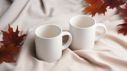 two white cup of coffee a cozy woolen scarf and fall maple autumn leaves