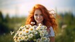 Close-up portrait of a beautiful red-haired girl in a simple dress standing on a spring summer field with a bouquet of chamomile. Tenderness of a woman.