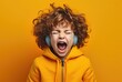 Music and excitement - young child with headphones and a big mouth