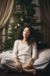 © shelbys - A woman meditating in front of a Christmas tree A fictional character created by Generated AI.