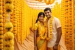 A happy couple posing in front of a vibrant yellow and orange background A fictional character created by Generated AI. 