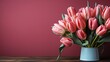 Bouquet of colorful tulips on an empty wooden table with copy space.