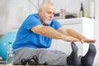 senior man warmup stretching training indoors