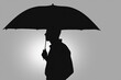 man with an umbrella. black male silhouette with an umbrella, close-up. rain concept