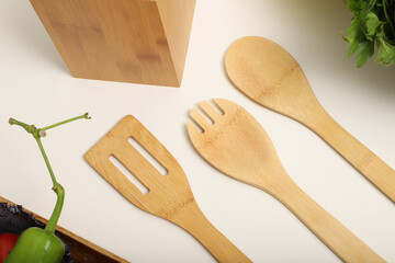 Wall Mural - Wooden Bamboo Utensil Holder, bamboo kitchen utensils, Bamboo Utensil Holder, Garden Salad, Bamboo Salad Set, close-up and concept shot. e-commerce photos, free space for writing,