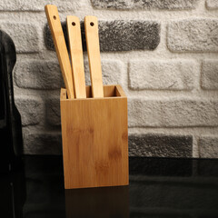 Wall Mural - Wooden Bamboo Utensil Holder, bamboo kitchen utensils, Bamboo Utensil Holder, Garden Salad, Bamboo Salad Set, close-up and concept shot. e-commerce photos, free space for writing,