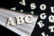 English wooden letters and book