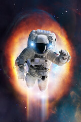 Wall Mural - epic view of an astronaut in spacesuit in space with stars, nebula and galaxy around him. elements o