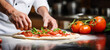 © ronstik - hand closeup of chef preparing italian pizza in kitchen. banner with copy space